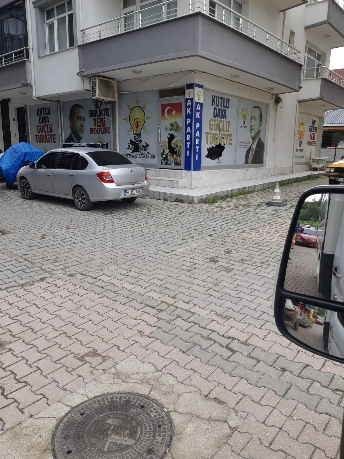 Protesters pelting stones at AKP headquarters over director appointment.